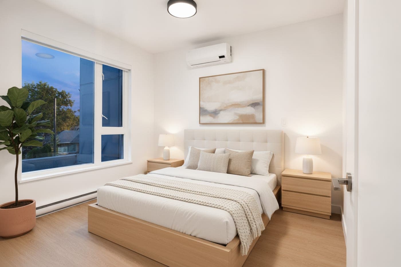 Bedroom with a corner window — virtually staged